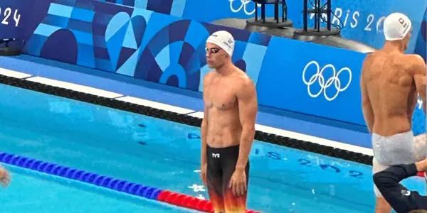 Denis Loktev stands on the blocks at the Olympics