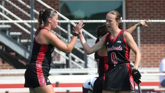 The field hockey team celebrates a goal in the scrimmage against Bellarmin