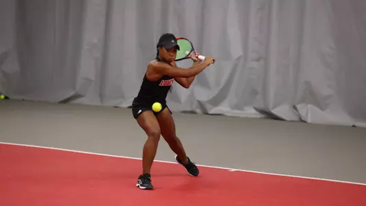 Germany Davis crouches down to hit a backhand shot