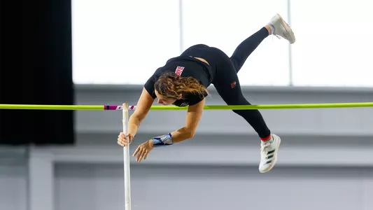 Natalie Lark clears the bar in the pole vault at the Louisville Opener.