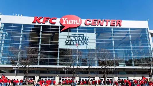 Fans gather outside of the KFC Yum! Center for a Louisville Basketball game.