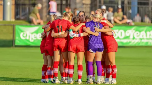 Louisville huddles before match against Notre Dame