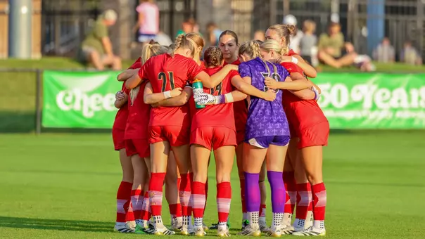 Louisville huddles before match against Notre Dame