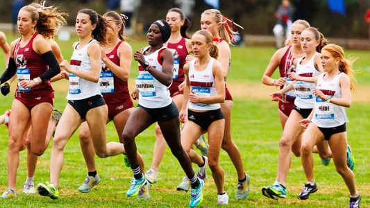 The Louisville women's team races off the start line at the ACC Cross Country Championships.