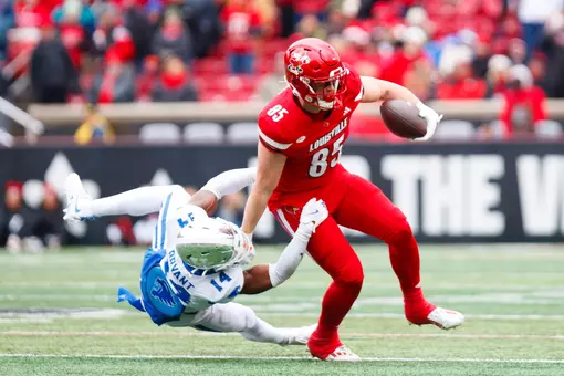 Nate Kurisky stiff arming a defender during the game against Kentucky at L&N Stadium on November 29.