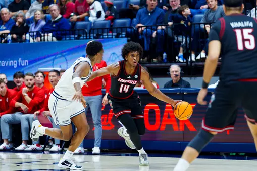 Adrian Wooley dribbles at California