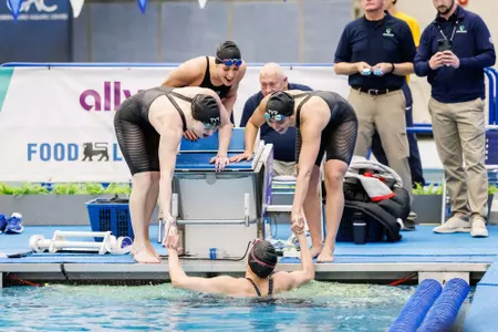 The relay team of Abby Karl, Caroline Larsen, Gabi Albiero and Julia Dennis win bronze