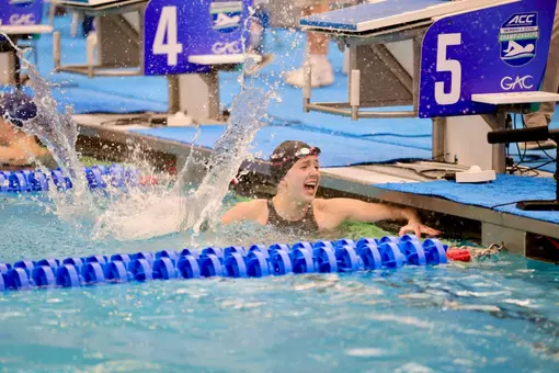 Julia Dennis celebrates her silver medal in the 50 free