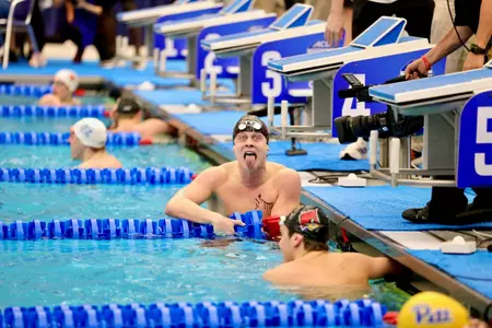 tommy Bried celebrates his gold medal swim
