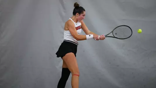 Allie Gretkowski bends down to hit a backhand shot
