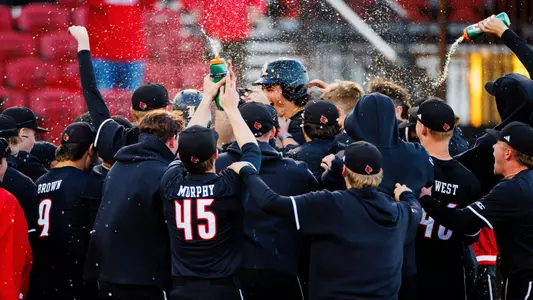 The Cardinals celebrating Tague Davis' walk-off home run against St. John's.