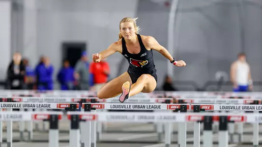 Lucy Fellows clears a hurdle at the 2024 Louisville Opener