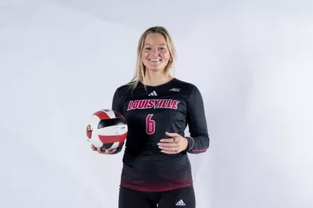 Molly Wilson poses in her Louisville uniform