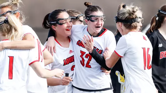 Maggie McMahon and the Cardinals celebrate a goal during the Denver game
