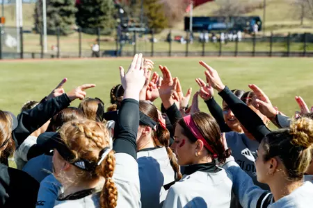 The Cards huddle before the game against Central Michigan at Ulmer Stadium on February 28.