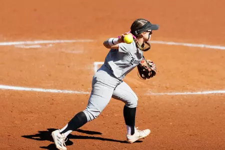 Ally Alexander throws the ball to first base against Central Michigan at Ulmer Stadium on February 28.