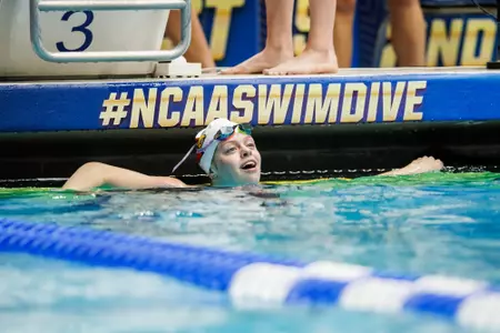 Ella Welch smiles after advancing to the championship final of the 100 fly