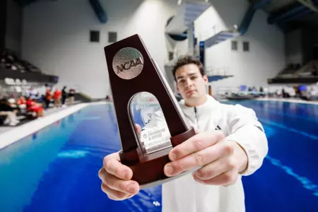 Denis Petrashov shows off his NCAA Runnerup trophy