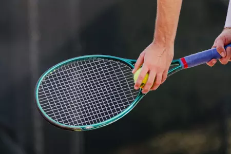 Piet Steveker prepares to serve against Virginia Tech at the Bass-Rudd Tennis Center on March 28.