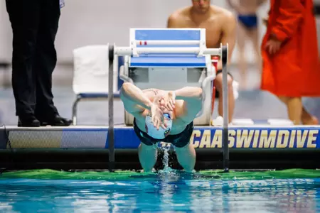 Filip Kosinski blasts off the wall in the backstroke