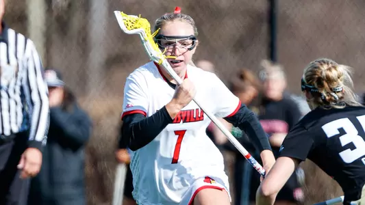 Abby Scully with the ball in the game against  Denver