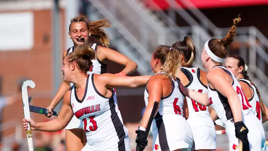 The field hockey team celebrates a goal during the game against Cornell