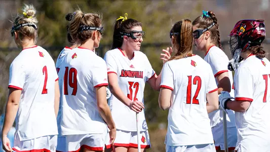 Louisville lacrosse team huddle