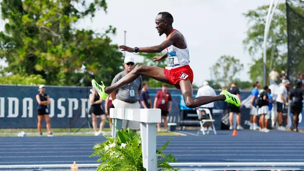 Geoffrey Kirwa hurdles the water barrier in the 3000m steeplechase at the 2025 NCAA East Regional.