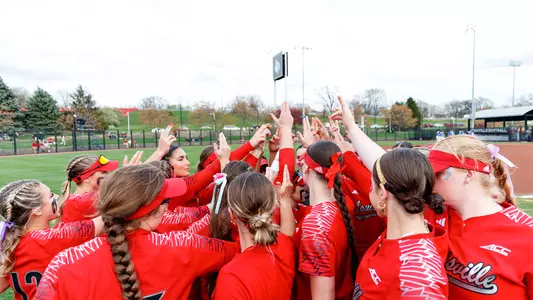 Louisville softball team huddle