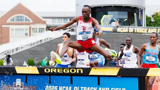 Geoffrey Kirwa clears the water barrier in the 3000m steeplechase at the 2025 NCAA Outdoor Championships