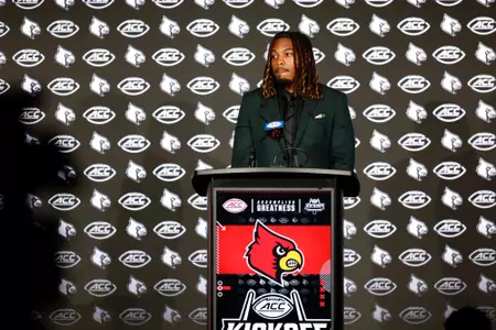TJ Quinn at the podium at the 2025 ACC Kickoff.