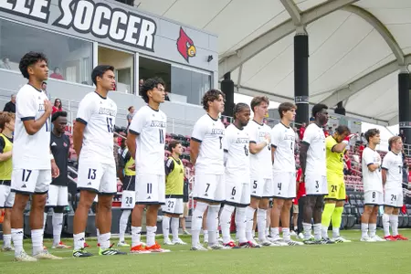 The Cardinals during the anthem before the game against Southern Indiana on August 21st.