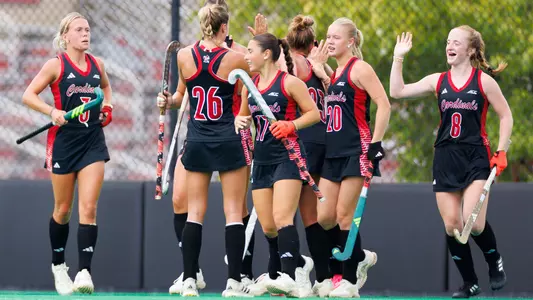 The field hockey team celebrates after a goal during the preseason scrimmage against Bellarmine
