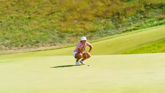 Bailey Burkett eyes a putt in Round 1 of Moon Golf Invitational