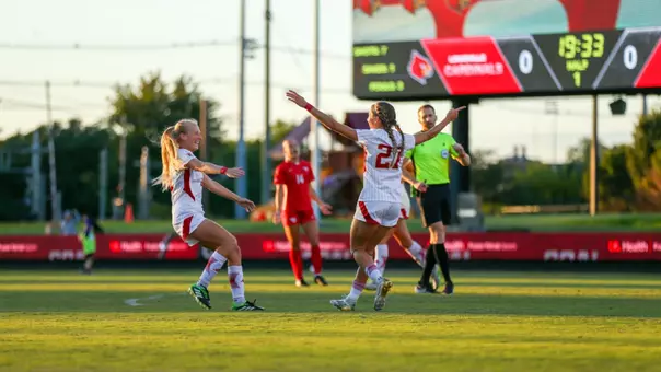 Liza Suydam and Emersen Jennings celebrate against Dayton