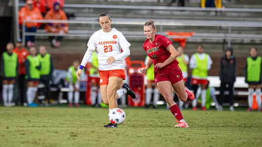 Fina Davy races a Clemson player to the ball