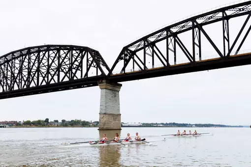 Louisville rowing under the bridge on the Ohio River