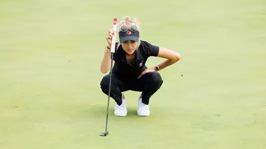 Madison Moman eyes a putt