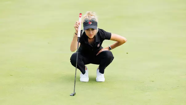 Madison Moman eyes a putt