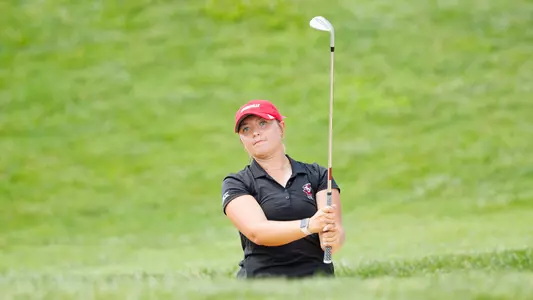 Bailey Burkett hits a chip shot