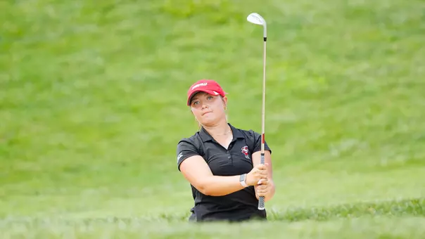 Bailey Burkett hits a chip shot