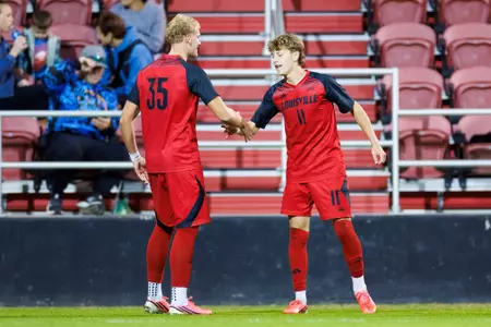 Cooper Olson and Brody Mayer celebrate during the game against Spalding at the Dr. Mark and Cindy Lynn Stadium on October 21.
