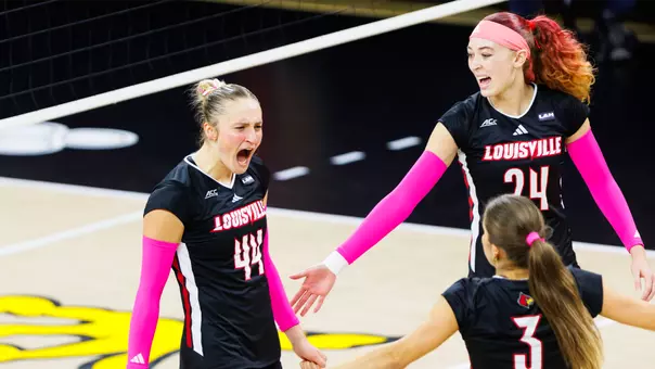 Brooke Bultema, Kalyssa Blackshear and Kamden Schrand celebrate a point against Stanford
