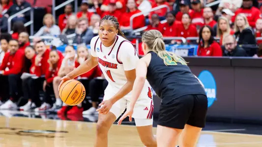 Mackenly Randolph dribbles the ball up the court during the game against Vermont in the first round of NCAA tournament at the KFC YUM! Center on March 21st, 2026.