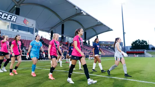 Betsy Huckaby, Liza Suydam, Brielle Baker and Norah Roush walk onto the pitch for introductions vs. Syracuse