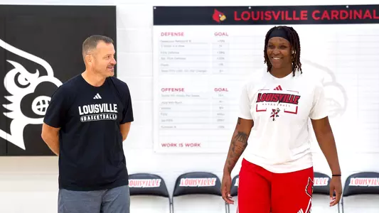 Amiya Joyner and Jeff Walz at practice