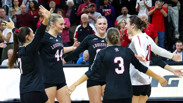 Louisville celebrates a point against Clemson