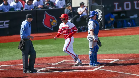 Alex Alicea scoring a run against Pitt.