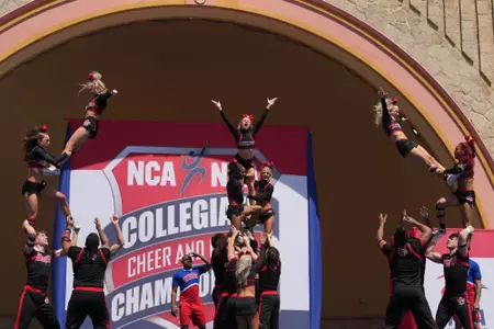 The Large Co-ED Cheer Squad compete at the NCA National Championship on stage