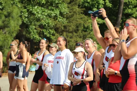 Rowing team cheering on teammates at Lake Wheeler Invitational